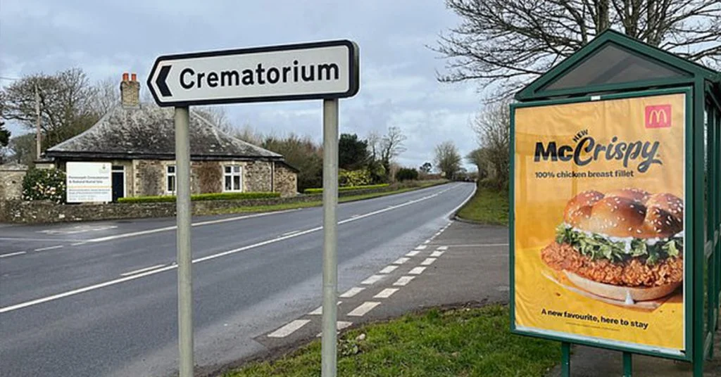 Example of a bad billboard design from McDonalds who advertised a McCrispy next to a crematorium sign.